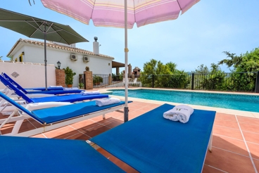 Holiday home with fenced pool and spacious terrace with views